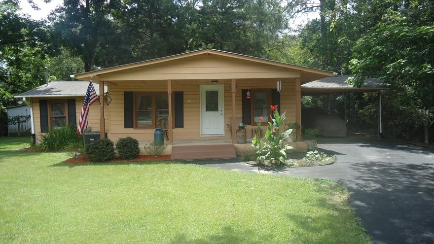 Older home with lots of updates. Metal roof, Hot water heater and Central unit replaced in 2008. New kitchen cabinets. Laminate flooring and carpet. Large fenced in back yard with workshop with 220 electric in place. It is presently being used as a 2 BR but could be a 3BR. Make appointment to see this home!!!