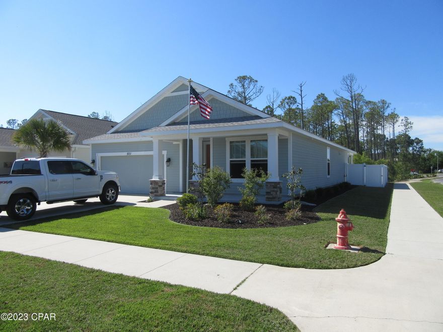 Beautiful 4 Bedroom, 3 Bath Home In One Of The Most Desirable Neighborhoods In Panama City Beach - Breakfast Point! This Home Sits On An Oversized Corner Lot Boasting a Large Fenced In Backyard With a Covered Patio with a Direct View of The School, While Also Backing Up To Peaceful Conservation Land With No Neighbors Behind You. Say Goodbye To High Electricity Bills as This Home Sports Large & Efficient Solar Panels Providing Sweet Relief Year-Round! This Home Is Excellent For Those With Kids as It Is A Short Walk Away, If Not The Closest Home In The Neighborhood, To J.R Arnold High School & Breakfast Point Academy. The Inside Of The Home Features a Tiled Large Open Concept Living Area Wired For Surround Sound, Granite Countertops, Walk In Pantry, Tons of Cabinets & a Tiled Backsplash. Bra