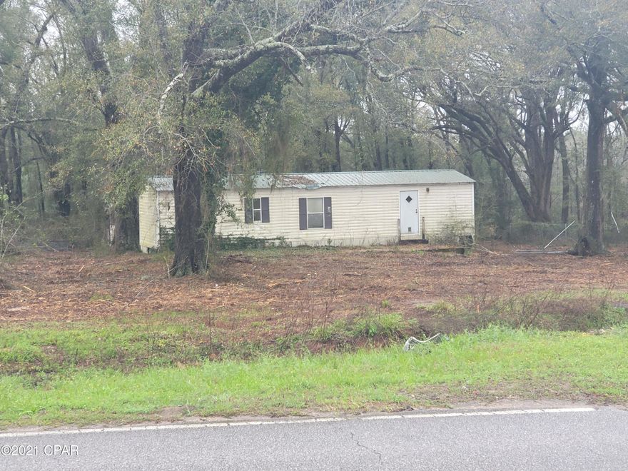 Lots of potential with this 3+/- acres with 2 older mobile homes and pole barn. Bring your handyman skills to bring back the 2 mobile homes to use as a personal home or possible rental property. The property with the 2 mobile homes is zoned in low density residential and the land with the pole barn is zoned AG. Buyer to verify any/all information.  Property was recently cleared and has paved road frontage on two sides. Not far from Chipley, Bonifay, or Panama City.