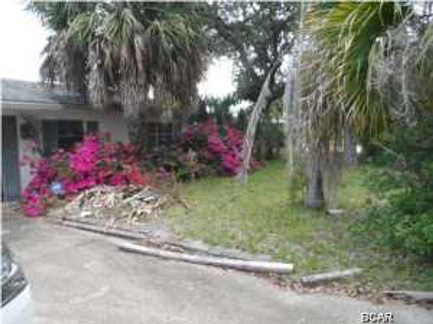 Nice lagoon lot but house need extensive work.