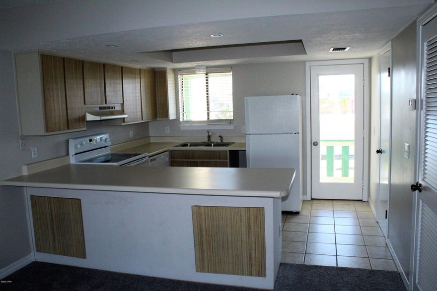 'CURRENTLY UNDER CONTRACT, SELLER ACCEPTING BACKUP OFFERS'  Beautiful Townhouse with a view of the Spectacular Emerald Green Gulf.  Newer carpeting throughout.  Great Location just steps away to the beach and within walking distance to restaurants and shopping.  Come and See!