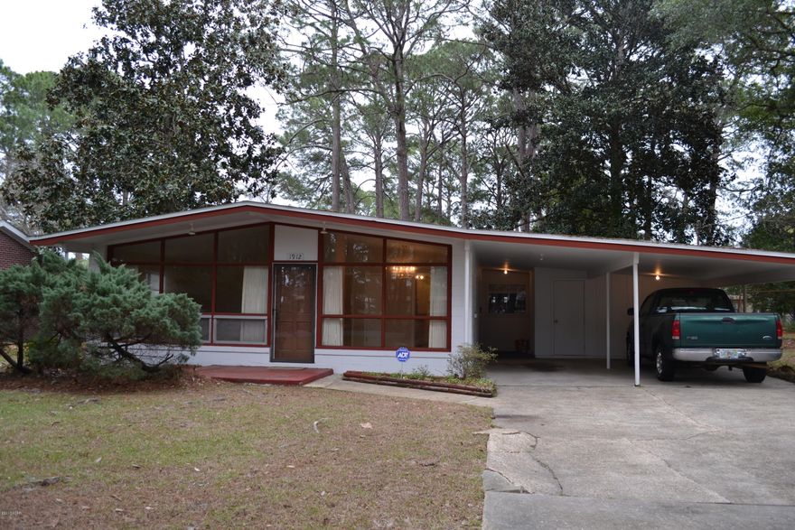 Seller will give $5000 in new flooring of the buyers choice with acceptable offer.  Here's a great St. Andrews home with almost 2000 sq. ft.  3 bedrooms, 2 full baths, the home has a separate very large den, formal living and dining room, eat in kitchen, numerous closets for plenty of storage.  There are cathedral ceilings in several rooms giving that more open feel.  The master bedroom has 3 closets. The HVAC unit was replaced in 2016 and the roof was replaced in 2008.  There is a 2 car carport, and a fenced back yard, and storage building in back yard.  The interior was just freshly painted and it's ready for your new touches.  This property sits on two full lots.