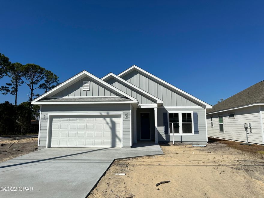 Completion scheduled for late October 2022. Great opportunity to purchase a beautifully constructed brand new home, centrally located in Panama City Beach, with no HOA fees! Located directly next door to several other lots that will soon have new homes from the same Builder as part of the ''Laurie Collection'', this open floor plan home features 9' ceilings, LVT flooring throughout, tiled master shower, double vanity master bath, stainless range/microwave/dishwasher, large kitchen island, large living area, large master bedroom with tray ceiling, very large back yard, and a 2 car garage. The house is on city sewage and water. This home has been constructed with quality materials throughout, including granite counter tops, hardie-board siding, enhanced insulation, 30 year shingles, professional landscaping(including irrigation), and to top it off this house comes with the peace of mind of a Builder's Warranty

All sizes and measurements are approximate, verify if important.