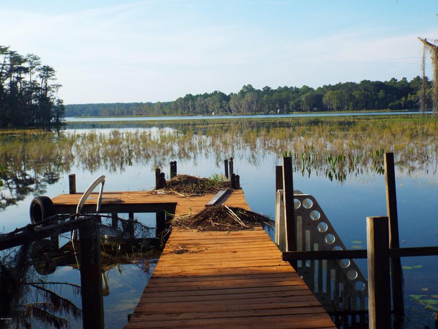 If you are looking for that private lakefront property for a get away or to build your dream home, you have found it. This lot is very private and is located at the end of a cul de sac. It has a small dock that needs some TLC and is less that 1/4 mile away from a boat ramp.