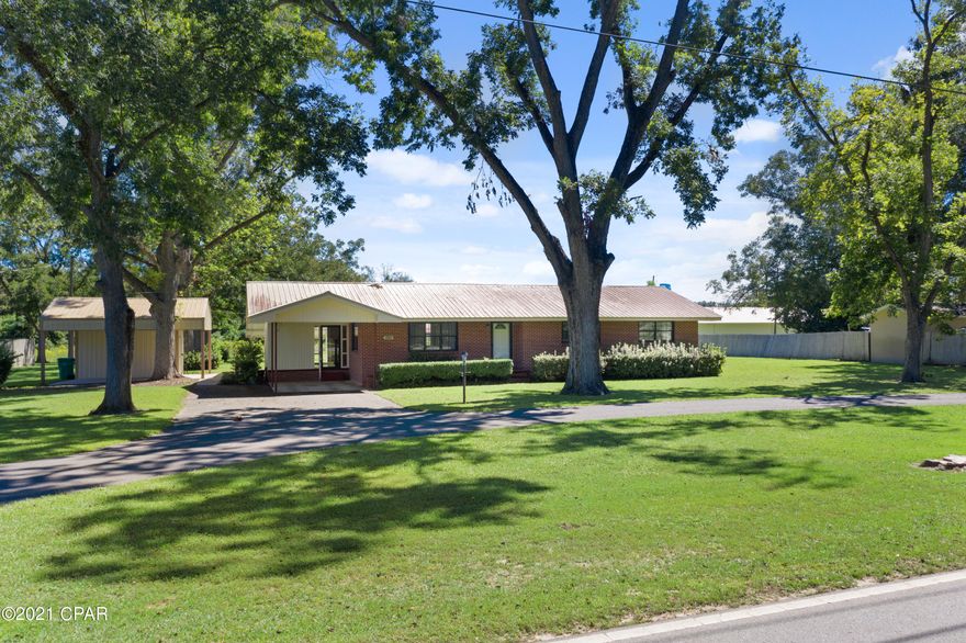 CURRENTLY UNDER CONTRACT, SELLER ACCEPTING BACKUP OFFERS  Well maintained Brick homes minutes from shopping and hospital.  This three bedroom two bath home with circle drive covered patio area, storage building and barn. Home has open floor plan, with vinyl plank  in living area. 12x16 outbuilding, 2 additional storage rooms under roof line of home. Barn also on property.