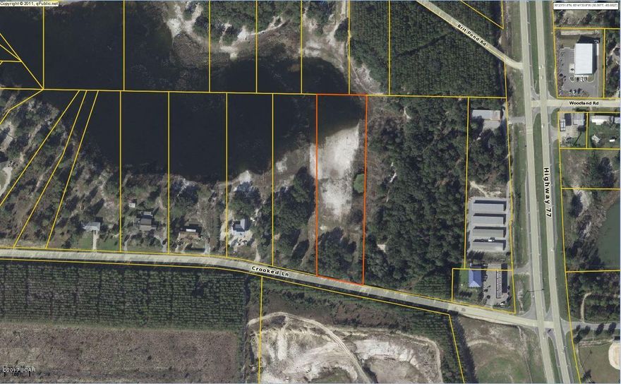 Very nice cleared lot on a pond right on Crooked Lane. There are three total acres in this parcel, and the lot is fenced and gated. Make your appointment to see this great parcel today!