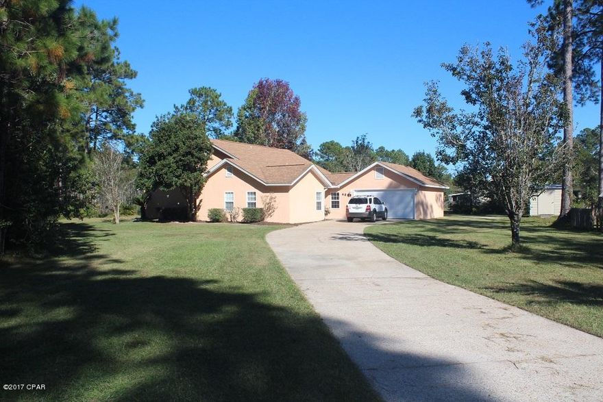 Well cared for home located in Sandy Creek Ranch & Country Club.  The neighborhood is located just a short distance from the hustle and bustle of town.  But only a 15 minute drive to shopping, restaurants and Tyndall Air Force Base.  This neighborhood is just down the street from the ship yard as well.  The home is located on a nice large lot with privacy.  The interior has been completely painted throughout.  The home features 4 bedrooms and 2 baths, vaulted ceilings, open split floor plan, brick fireplace, 2 car garage, open kitchen with breakfast nook, and  granite counter tops.  The home is located at the end of the street on a round a bout so there is not much drive through traffic.  The exterior of the home has nice landscaping, privacy and yard shed.