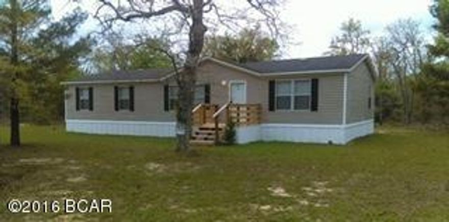 What a find. This immaculate 3 bedroom home on over an acre 30 minutes from Panama City and the worlds most beautiful beaches. Located about 4 miles from compass lake which has a public boat landing. This home has a nice open floor plan and very large bedrooms. It is country living at it's best. Home is on a paved road, no close neighbors.. have a BBQ or a bonfire and you wont bother anyone...All sized are approximate, please measure if important.