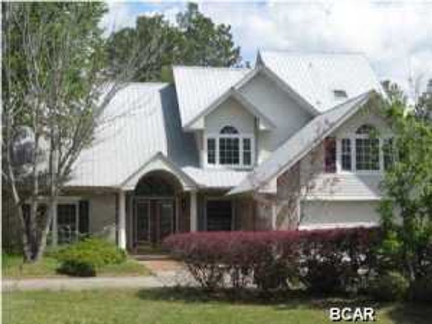 This is a beautiful home located in a quite neighborhood across the street from Deer Point Lake, offers 3 bedrooms two upstairs with wood flooring, master bedroom down stairs , granite counter tops beautiful white kitchen cabinets, living room offers wood flooring and fireplace , Has two extra rooms down stairs. Metal Roof . Shelter in back yard for grilling or cleaning fish. Guest house out back with own garage for parking, This is a must see. Being Sold As Is.