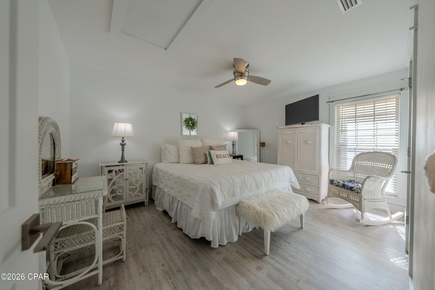 WEDNESDAY (2/25/26) OPEN HOUSE 11:00- 1:00pm. Welcome to this beautifully renovated, first-floor one-bedroom, one-bath villa in the highly desirable Horizon South beach community. Thoughtfully updated and impeccably maintained, this turnkey residence offers a refined coastal aesthetic and is ideal as a primary home, elegant beach retreat, or high-performing vacation rental. The interior is light and sophisticated, featuring white-washed luxury vinyl plank flooring, quartz countertops in both the kitchen and bath, stainless steel appliances, and a vaulted living and dining area that enhances the open, airy feel. There are no popcorn ceilings, reinforcing the home's clean, modern design. Expansive sliding glass doors open to an enclosed and furnished patio with an outdoor shower, creating a seamless indoor-outdoor coastal lifestyle. An electric fireplace and stackable washer and dryer add both comfort and convenience. Major systems including the roof, HVAC, water heater, windows, and sliding glass doors have all been replaced within the last six years, providing exceptional peace of mind. Residents enjoy a short walk or golf cart ride to the beach in this pet-friendly, golf-cart-friendly community that allows both short-term and long-term rentals. Horizon South is known for offering more amenities than any other beach community, including four pools, mini golf, a hot tub, tennis and pickleball courts, a game room, a community center, and a recently updated fitness center. The only thing left to do is arrive and unwind, as the Gulf of America is just a four-minute walk from your door, offering effortless beach access and a lifestyle designed for relaxation.