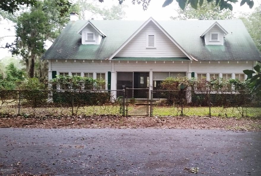 Water Front, Johnson Bayou, with access to the St. Andrew Bay. A hidden Diamond in the Rough nestled in the most prestigious older part of town.   Use your utmost Southern imagination to refurbish this unique find, with the original wood floors, still in beautiful and very good condition. Each room opens off the Formal Areas room with  Double French doors.  With a little small amount of repairs spend your leisure time on the Dock, and Boat house.  The Carriage house is just waiting to be brought back to life. The exterior has the original Shake shingles.

This property to be written on ''As IS'' contract.  Seller will not make repairs.

Home has not been lived in for the last three years. AC/Heat does not work.  Please show early, Utilities are not turned on.