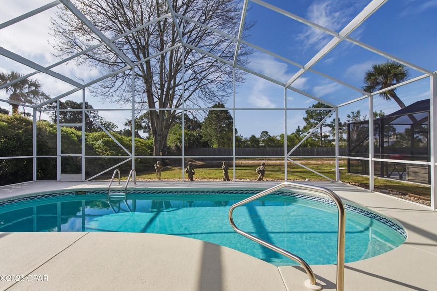 Welcome to your slice of paradise in The Glades! Ideally located just minutes from the white-sand beaches of Panama City Beach, this beautifully situated home offers the perfect blend of convenience and relaxation--only a short drive to popular attractions like Duplin Winery, shopping, dining, and entertainment.

Inside, you'll find a bright and inviting open-concept kitchen and living area, perfect for entertaining or everyday living. The seamless layout creates a spacious feel with plenty of natural light.

Step outside to your private retreat featuring a screened-in pool overlooking a peaceful pond, offering serene water views and added privacy. Whether you're enjoying your morning coffee or hosting guests, this outdoor space is designed for true Florida living.

Don't miss this opportunity to own a home in one of Panama City Beach's most desirable communities--close to the beach, yet tucked away in a quiet, scenic setting.