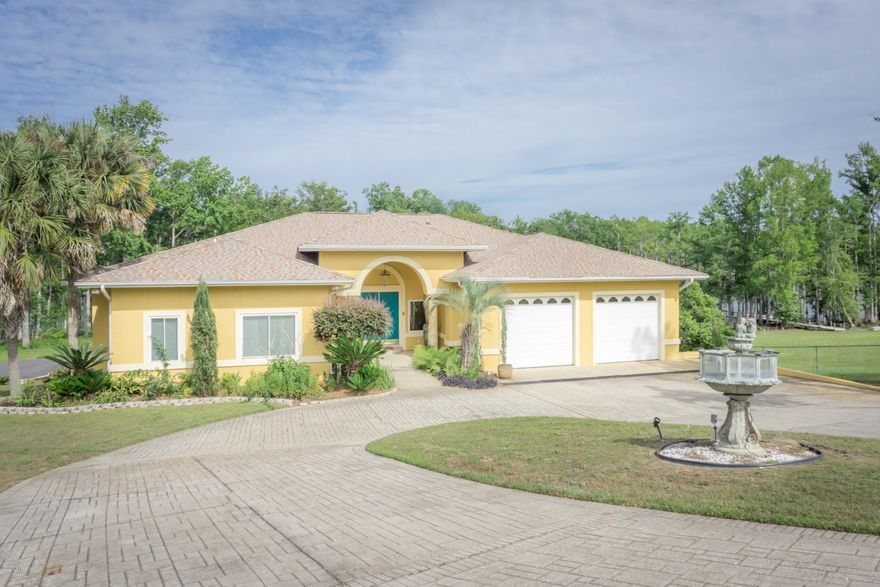 Beautiful waterfront home in desirable Spring Chase neighborhood. The home features an open floor plan with generous sized living spaces, wet bar, fire place, and back deck overlooking the spacious back yard with views of Merritt's Mill Pond. The huge master bedroom has views of the Mill Pond and features a unique en suite master bathroom with large walk in closet and double entry tiled shower, and two separate vanities. There are 3 bedrooms and 3 bathrooms on the main level. There is a finished walk-out basement that has an additional bedroom, bathroom, living space, large back patio, and heated and cooled room that is being used for storage, but could easily be used as a workshop or home gym as well. The lot is gently sloping to the water so not as steep as surrounding waterfront lots.