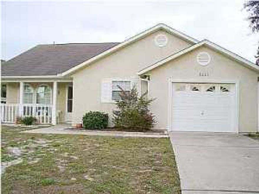 Absolutely immaculate home within walking distance to the beach! Features open floor plan, cathedral ceiling, split bedroom plan, ceramic tile throughout, breakfast bar, privacy fenced back yard, and 1-car garage.