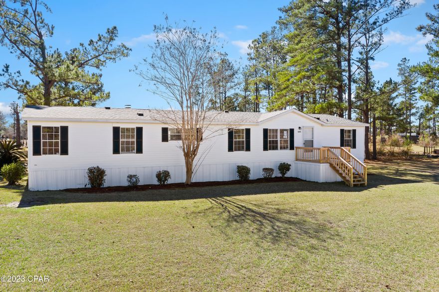 This is an updated doublewide home on a small lake .It has updated vinyl plank floors throughout, new light fixtures, new kitchen cabinets and granite counter tops.  It has fresh paint throughout and a new rear deck that overlooks the back yard and lake.  There is also a new front deck and steps.  It feature a split bedroom design and has 4 bedrooms and 2 baths. The large den has a beautiful fireplace.  It also has a new HVAC, and a new well pump.  A real gem siting on 2.130 acres!!