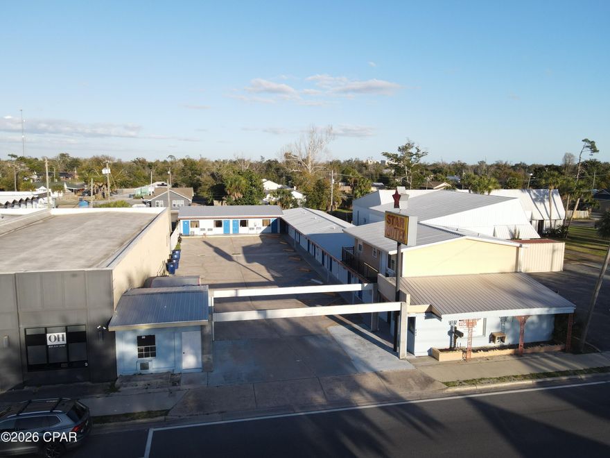 Positioned at 836 Harrison Avenue in Panama City, Florida, this 12-room motel presents a rare and compelling opportunity for investors and operators seeking a foothold in one of the Gulf Coast's most energetically transforming corridors. The property sits squarely within a neighborhood experiencing a genuine renaissance -- a dynamic revival of local commerce, community investment, and visitor interest that is reshaping the surrounding area and driving meaningful demand for quality lodging.
Whether pursued as a value-add repositioning play, a boutique hospitality redevelopment, or a stabilized income-producing asset, this motel delivers the physical footprint, flexible room mix, and strategic location to support a variety of ownership visions.

This property qualifies for a community-based grant program specifically targeting exterior rehabilitation within the revitalization corridor. The available grant funding represents a significant capital contribution toward cosmetic and structural improvements to the building's facade, signage, landscaping, and public-facing elements -- improvements that drive curb appeal, brand perception, and guest acquisition.

The Harrison Avenue corridor is in the midst of a well-documented revitalization. New businesses, arts venues, dining concepts, and public infrastructure investments are converging to create a vibrant, walkable district that is attracting both residents and visitors who would previously have bypassed the area. This type of neighborhood momentum -- where private investment and public commitment reinforce each other -- historically precedes significant increases in lodging demand, average daily rate, and property values.