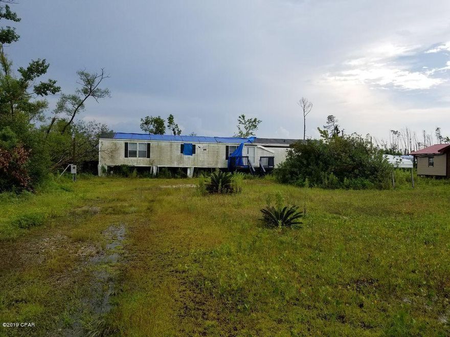 Sold AS-IS. Hurricane damage. Entered for comp purposes.