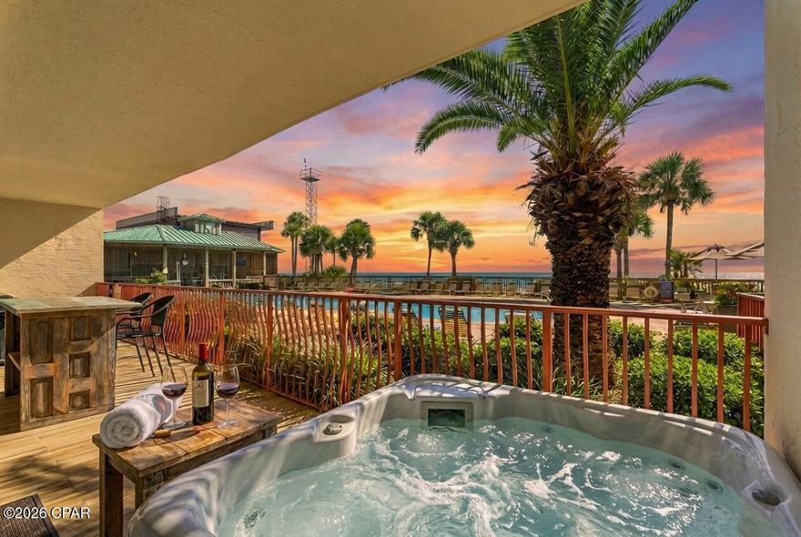Rare opportunity to own a fully renovated & fully Furnished Gulf-front FIRST-FLOOR residence with PRIVATE BEACH ACCESS FROM YOUR BALCONY and a deeded covered parking space just steps from the front door. NO STAIRS, NO WAITING ON ELEVATIORS and short term rentals allowed. This unit is also the only first-floor handicap accessible unit available for sale in all of Panama City Beach. Watch breathtaking sunsets from your 328 sq. ft. private balcony, complete with its own hot tub and grill overlooking the emerald waters. This one-of-a-kind home offers unmatched convenience and luxury with direct, gated access from your back patio to the pool deck and beach walkover.

The property has been fully renovated with exceptional craftsmanship and high-end finishes. A formal foyer sets the tone with pecky cypress ceiling detail and shiplap accents. Tile flooring flows seamlessly throughout, combining durability with coastal elegance. Two spacious guest bedrooms are located off the entry—one with a private ensuite featuring quartz countertops and a tiled shower, and the other with a full bath shared with the main living area that includes a tiled shower and quartz vanity. Crown molding and new baseboards throughout complete the timeless coastal design.

The open living and dining areas are defined by wall-to-wall windows stretching the entire length of the living space, filling the home with natural light and showcasing panoramic Gulf views. The dining wall is accented with shiplap, while the living room features a custom bookcase surrounding the electric fireplace. The kitchen is a true centerpiece with pecky cypress ceiling accents, floor-to-ceiling cabinetry, quartz countertops and backsplash, a farmhouse sink, stainless-steel appliances, a pull-out trash, and a pantry-style end cabinet for additional storage.

The Gulf-facing master suite is generously sized, with sliding glass doors opening directly to the oversized balcony. The master bath is a luxurious retreat offering dual quartz vanities, custom cabinetry, a spacious tiled shower with two shower heads, and a freestanding soaking tub. The laundry room continues the thoughtful design with quartz counters, floor-to-ceiling cabinetry, abundant storage, and space for a side-by-side washer and dryer.

The private balcony is an outdoor haven featuring a hot tub, grill, and a gated walkout directly to the pool and beach—making it one of the most unique Gulf-front setups available. Community amenities include a guarded security gate, resort-style pool and hot tub, fitness center, and outdoor gathering spaces.

With abundant storage and closet space throughout, this residence is ideal as a full-time home, second home, or short-term rental investment. Tucked along the emerald waters of Panama City Beach, this hidden gem has been meticulously maintained and has not been rented since its complete renovation.

Air handler 3yrs old. Condensing unit 5yrs old

All sizes are approximate, please verify if important