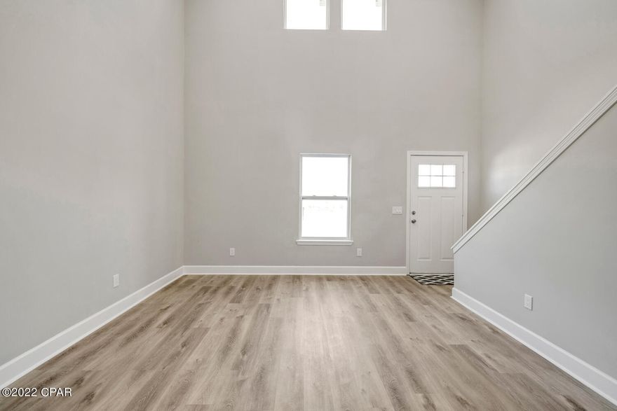 Totally renovated, like new 3br 2 ba townhome in Lynn Haven.  This one is absolutely beautiful.  The living room has a 2 story ceiling making it feel more luxurious. It has luxury vinyl plank flooring through out the living areas & bedrooms.  The kitchen and bathrooms are all new.  The lovely master bedroom suite is upstiars with everything else downstairs.  You'll appreciate all of the storage it offers.  This one has a large laundry room at the back of the home that leads outside to a fenced in yard.  It even includes a storage shed. The front is landscaped and nice.  It is move in ready!