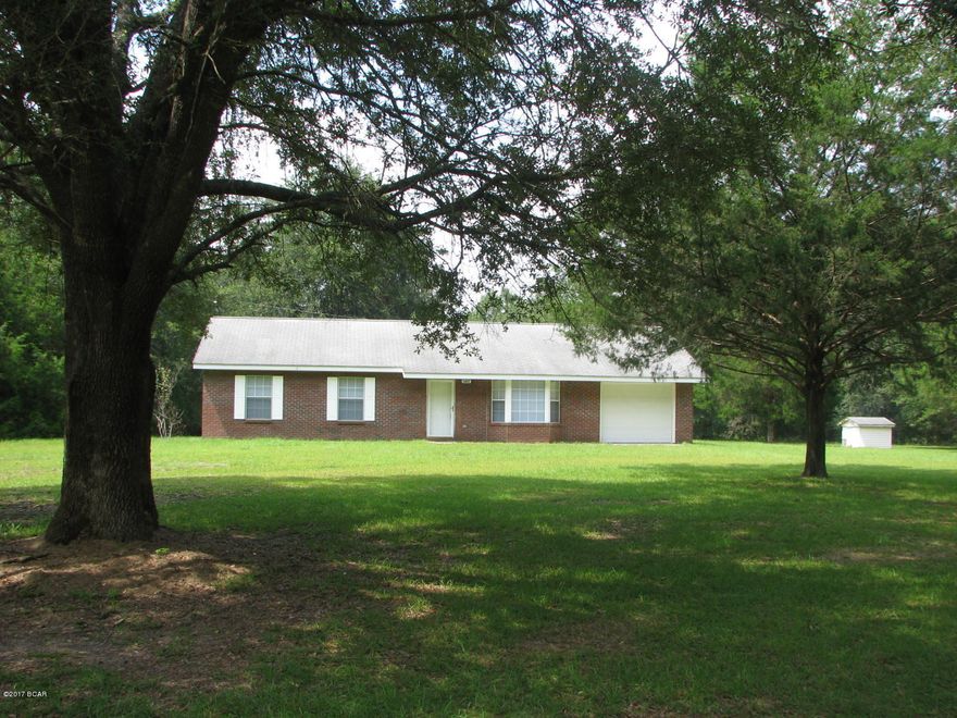 Nice brick home located in the Country located less than 10 miles from Marianna with approximately 3.5 acres (acreage will need to be verified by buyer with a survey, only selling property on same side of road as house).  The house features 3 bedrooms, 2 full baths, living and dining combination, kitchen with large breakfast area, a large laundry room and one car garage.  This house has been well maintained, and is all brick exterior which makes for low maintenance.