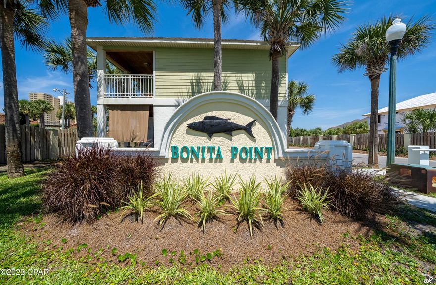 BONITA POINT ... lovely well established gated community just across street (Access 22) from beautiful Gulf of Mexico (2 blks).  Two BR and two full bath condo is situated directly on S.  Lagoon with large private covered balcony.  Unit could be homesteaded or used for long/short term rental.  Sellers have a 5 years history for short term rental.  Bonita Point offers many amenities such as community pool, clubhouse, and plenty of parking.  There are covered boat docks and slips are available for rent from HOA on a first-come first-serve basis.  Protected S. Lagoon waterfront with dockage and gulf access is a rarity. 
 Walking distance to Gulf of Mexico, dining, shopping, etc.  Excellent location!  This 2/2 comes completely furnished. It's move in ready!  Grill on balcony does not convey.  All measurements should be verified for accuracy.