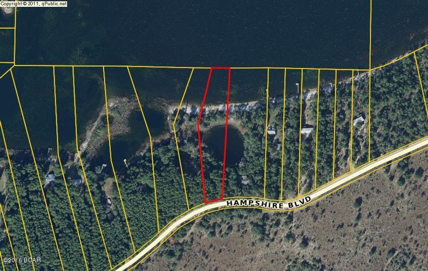 This is an excellent building lot on Porter Lake.  Porter Lake is located north of Panama City Beach and South of Chipley.  Lake is surrounded by Florida Water Management areas.  Come see this lot on the bluff looking north across the length of the lake.  This lot is waiting for your country lake/dream home.  Property does not have an assigned street number from the county.  The lot is between street address 1290 and 1300 Hampshire Boulevard.