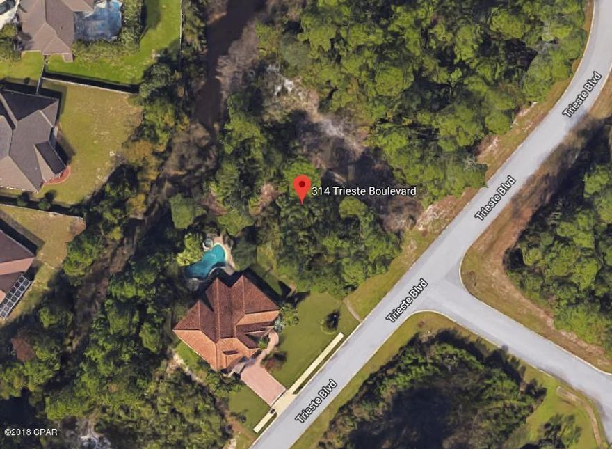 Beautiful waterfront lot in the gated community of Trieste.  You are central to everything on the beach. Golfing, Entertainment, shopping, restaurants, beach. What more do you need? Build your dream home among these mediterranean style homes.