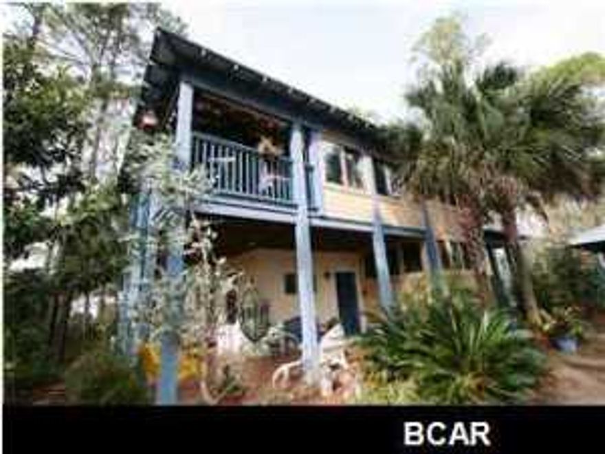 This Key West Style home located on a lot and a half is one of the nicest and most well built homes in Mexico Beach. The entire second floor is a very open kitchen/living/dining area with a recently added art room/workshop and a huge covered porch. All 3 bedrooms are located on the first floor along with tons of outdoor living area, a hot tub, and a very well-manicured yard. There is also covered parking and additional storage. This home was built by a builder to be their personal home and it's loaded with upgrades and custom work throughout the home. This home is located in a great quiet area of Mexico Beach surrounded by nice single family homes and just a short walk to the park and beach.