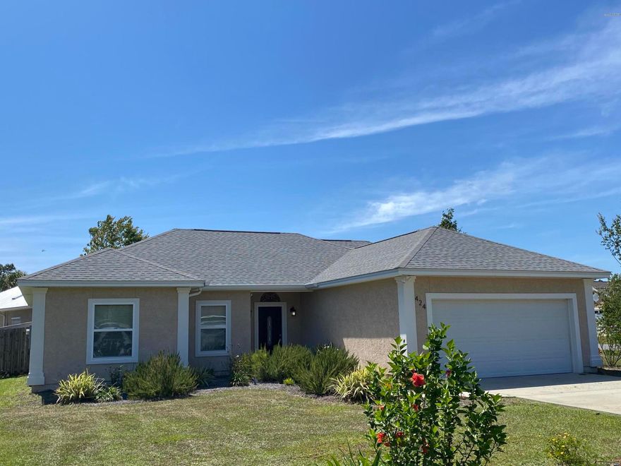 Hidden Pines subdivision:  3 bedroom, 2 bath, 1800 sf with office and 2 car garage.  Home features a very desirable split bedroom floor plan, office nook off the 2nd bedroom, laundry room conveniently located off the master bath and kitchen.  Master bedroom features his and hers walk in closets, large separate tile shower and separate tub.  Kitchen features granite counter tops and stainless steel appliances and also includes the washer and dryer.  Living room features a wood burning fireplace and wood plank floors all overlooking the back covered patio and back yard.  Back yard also has small detached storage building.