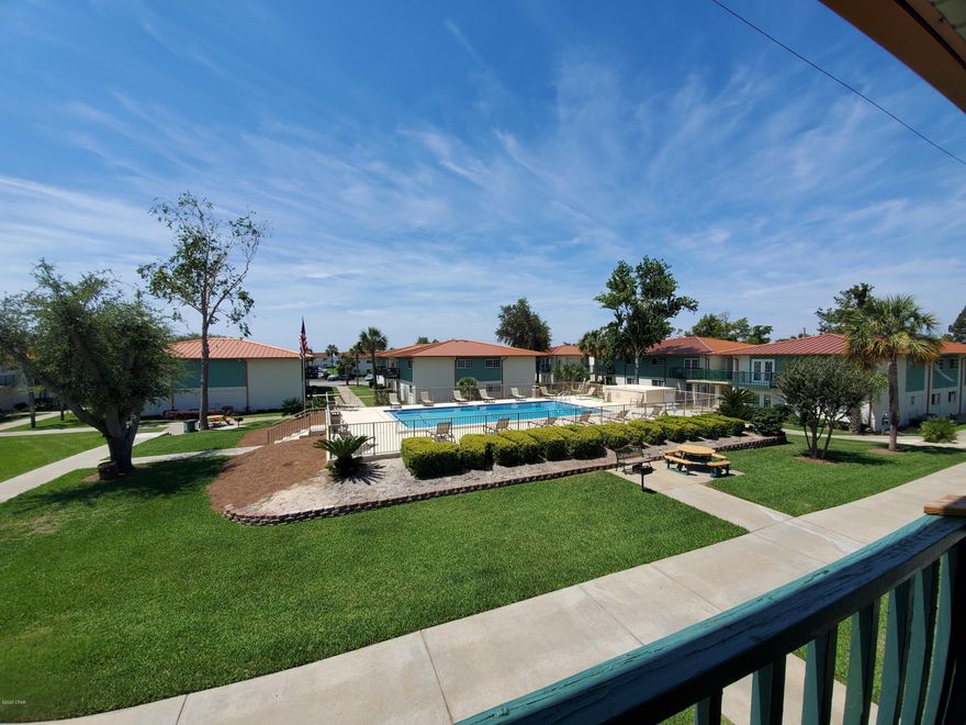 PROPERTY IS CURRENTLY UNDER CONTRACT, SELLER ACCEPTING BACK UP OFFERS. Absolutely GORGEOUS! Updated, fully FURNISHED 2 BR/1 BA Landmark condo situated facing the South overlooking the lush landscaped courtyard & north pool! All new kitchen with accent lighted back splash, custom soft close cabinetry, new stainless appliances and quartz counters. New grey vinyl plank flooring throughout the condo with new coastal modern lighting. The bathroom has a new custom cabinet vanity with quartz counters, and fixtures. This is truly a must see Landmark condo! A Bay front community featuring two pools, clubhouse, dock, and private beach. It's situated in the heart of St. Andrews close to the local's favorite spots!