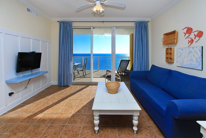 Phenomenal East end corner unit penthouse with expansive wraparound views of the Gulf of Mexico. The corner units do not come on the market often and will not last long! Unit #2001 is 2-bedroom, 2-bath upgraded condo totaling 1,173 square feet with a 10 x 29 foot private balcony with incredible Eastern Gulf and coastline views. There are no high rises directly to the East so this location in the building feels very private and quiet. Experience both sunrises and sunsets from the balcony which is a rare treat! The interior is in great condition with custom wainscoting for a unique look, raised ceilings, thick crown molding and tile floors in the main living area, kitchen and bathrooms. The open floor plan allows the unit to feel very spacious and the pride of ownership is apparent. This unit is very well maintained (only lightly rented) and will also be sold fully furnished & decorated. There is a dining area for six with Gulf views and a granite breakfast bar for casual dining. Tile was added underneath for easy maintenance. The kitchen is beautiful with light granite countertops, plentiful hardwood cabinets, tile backsplash, updated lighting & stainless steel appliances. The Gulf front master bedroom is very spacious with direct balcony access and en-suite bathroom with tile floors and shower/tub combo. The guest bedroom is similar in size and on the other side of the unit for privacy. There is a laundry room with a stackable washer & dryer, an owner's closet and two deeded parking spaces - one covered with Gulf views in the underground parking (directly across from the elevator) and the other one is across the street, on the first level. This is a great opportunity to own a pristine corner unit on one of the penthouse levels. 

Tropic Winds is a low-density building consisting of only 164 units on the desirable West end of Panama City Beach, close to 30A and Pier Park to the East. Enjoy luxury amenities including a Gulf front indoor/outdoor pool (seasonally heated), steam room, sauna, Gulf front fitness center & community room, gas & charcoal grills, sun deck, large Gulf front hot tub and designated beach. There is even a designated pet area (for owners) and security cameras. You will not be disappointed at one of the newest condos in the Panama City Beach area.