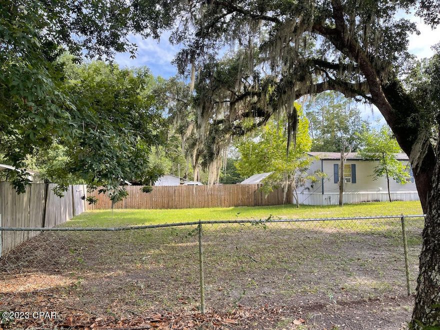 Investor Special!! Great location, not far to the airport or the beach located in West Bay just off of Hwy 79 and south of the new Margarittaville Development!! Large 1 acre corner lot with 2 septic systems on site and would be great for multiple new homes!! Just down the street from a boast ramp, Buchanan Park and Boondocks restaurant!! There are 2 mobile homes on site included in the sale but being sold for land value only!! Sold as-is
