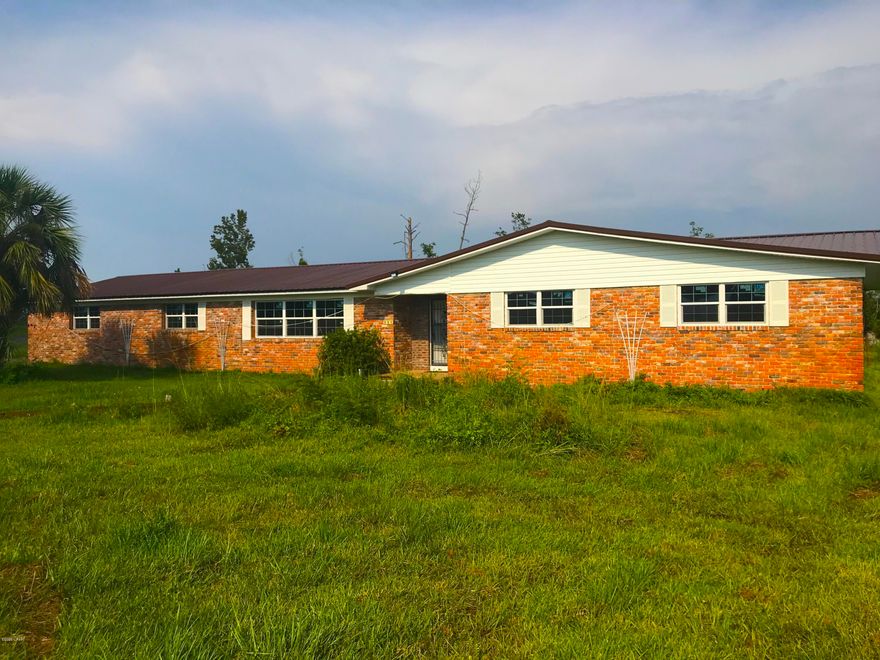 AMAZING fix & flip or investment opportunity with this LARGE BRICK HOME in Panama City! This home is huge - It's 3,105 sqft. (heated) and 3,824 sqft. (total) with 4 Beds / 3 Baths and sits on a HUGE LOT that is 1.16 acres. In the backyard there is a HUGE IN-GROUND POOL measuring about 18 by 40 ft. with a surrounding concrete patio, as well as a shed. There is also a long circular driveway and stylish front entry fence that previously was gated. The home was damaged by Hurricane Michael and will need some work (ceiling, flooring, etc.) but a lot of work has already been done! There is a NEW METAL ROOF, NEW WINDOWS and NEW GARAGE DOOR. At this price this property will DEFINITELY NOT LAST LONG - So act quickly! --- CASH BUYERS ONLY ---