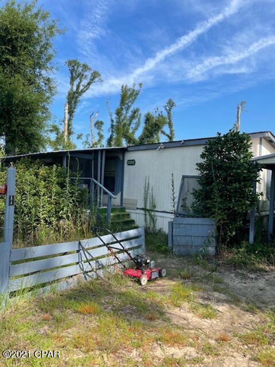 Great Investment with 1.90 acres just off of Hwy 73 in Marianna. Doublewide is a 1985 3 bedroom - 2 bath with 960 sq. ft.     Sellers says roof on doublewide is 6-7 years old.