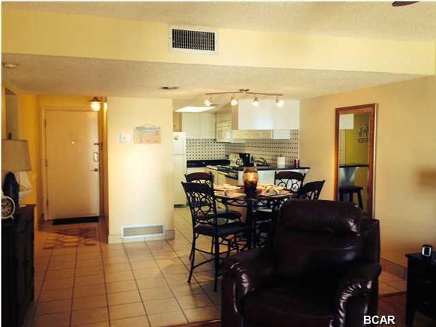 Must see this totally renovated 3rd floor Low-Rise Unit. This owner has gone all out with new tile, bamboo flooring, the kitchen features new appliances, granite countertops, cabinets and a very ''cool'' backsplash. There is also $10,000+ of brand new furnishings and TV;s included in this deal with acceptable offer. You will love this amazing condo! Check out all of the photo's.... This is one of the most desirable properties on Panama City Beach because of it's location as it sits between the Beautiful Gulf of Mexico and scenic Lake Powell. The property boarders Camp Helen State Park, with endless undeveloped beaches as you walk west into the sunset. The property itself is loaded with amenities, including one of the beaches only indoor/outdoor heated Olympic sized pools, tennis, gym