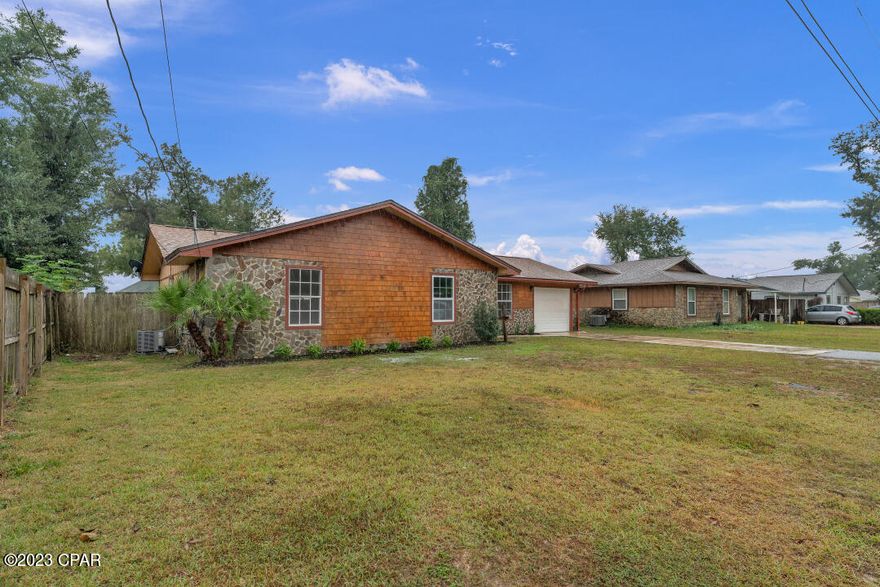 Discover serenity in this meticulously maintained 3-bed, 2-bath residence. The brand-new kitchen boasts stainless steel appliances, granite countertops, and shaker cabinets. Luxuriate in fully renovated bathrooms with modern finishes. The family room, featuring a fireplace and entertainment center, creates a cozy atmosphere for gatherings. Experience Florida living on the screened-in patio overlooking a fenced backyard. The 2018 roof and 2019 AC system ensure peace of mind. New flooring, updated fixtures, and fresh paint showcase meticulous attention to detail. Conveniently located near Tyndall AFB, dining, and shopping, this property seamlessly blends comfort, style, and functionality. Whether you're a first-time homebuyer or upgrading, seize the chance to make this property your own.