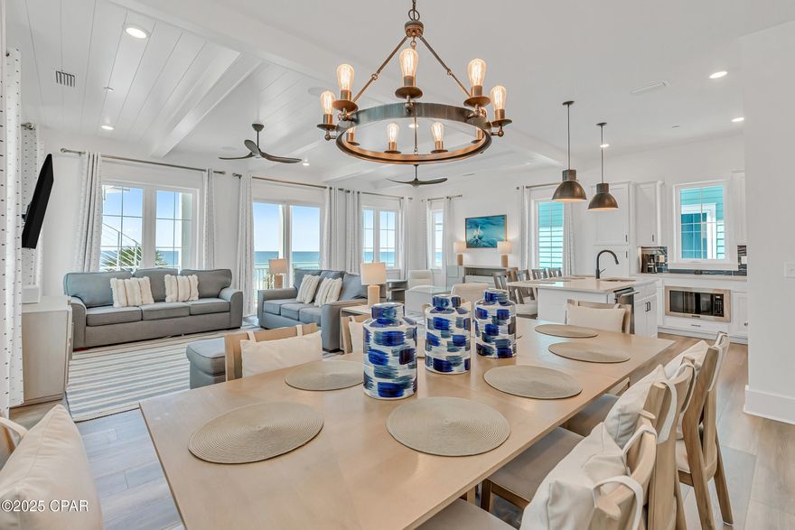 **SELLER FINANCING AVAILABLE** **PRIVATE ELEVATOR** This Gulf-front retreat in Margaritaville Beach Cottage Resort blends laid-back luxury with modern comfort, offering the ultimate escape in Panama City Beach. Built in 2023 and sold fully furnished, this Oasis floor plan spans 3,990 square feet across three levels - all with unobstructed views of the emerald Gulf waters. Professionally designed with decor that captures the breezy, carefree vibe of the Margaritaville lifestyle, the home features luxury vinyl plank flooring throughout and a thoughtful layout tailored for both relaxed getaways and high-performing rentals. From morning coffee to sunset cocktails, enjoy panoramic Gulf views from your private balconies on every level. The first floor features a spacious recreation room with a foosball table, wet bar, full-sized refrigerator, and ice maker - perfect for entertaining after a day in the sun. Step outside to your private 8x17 beachfront pool and take the private dune walkover straight to the sand. With 6 bedrooms, a bunk area, and 6.5 bathrooms, this home comfortably accommodates large families and rental guests alike. The private elevator makes each level easily accessible. On the second floor, an open-concept great room takes full advantage of the water views, with a living area, dining space, and a chef's kitchen featuring Frigidaire Professional appliances, a 36'' gas range, quartz countertops, and maple cabinetry. Two guest suites with private baths, a powder room, and a full laundry area round out this level. Upstairs, the Gulf-facing primary suite offers a true retreat with expansive views down the coast, a walk-in closet, balcony access, and a spa-inspired ensuite with double vanities and a walk-in shower. Two more guest bedrooms with private baths and a cozy bunk nook complete the third floor. Additional features include a two-car covered carport plus parking for three more vehicles - rare for Gulf-front homes. As part of the Margaritaville Beach Cottage Resort, you and your guests have access to top-tier amenities: a resort-style pool with a 425-foot lazy river and H2O Adventure waterslides, pickleball court, indoor arcade, game lawn, hammock grove, and poolside movie nights. On-site dining options include The Salty Rim Bar & Grill, Fins Restaurant & Bar, and Joe Merchant's Coffee & Provisions - perfect for everything from poolside snacks to sunset dinners. Whether you're looking for a luxurious vacation home or a high-performing rental property, this is a rare opportunity to own in one of the most exciting beachfront resorts on the Emerald Coast. Call today to schedule your private tour and explore rental income potential, projections, and how to make this island-inspired dream a reality.