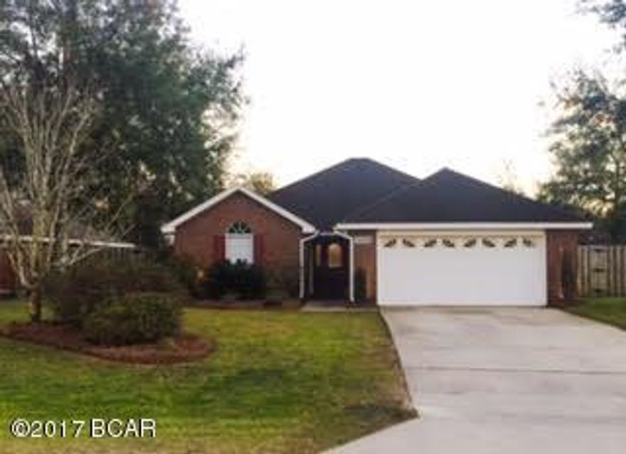 Beautiful brick home on quiet Lynn Haven culdesac. This 3 bedroom 2 bath house is 1,660 sq ft heated/cooled. There is also an office/bonus room with floor to ceiling cabinets for tons of storage. Hardwood flooring throughout with tile in bathrooms, kitchen/dining and office. Lots of extras in this home! The bedrooms and living room have tray/vaulted ceilings. The kitchen has a large walk in pantry. The living room has a wood burning fire place. There is additional storage/workshop area in the double car garage. There are two patios and one has a hot/cold water shower. It has a privacy fence in the back yard with a double gate on one side to park your toys. It has an automated irrigation system with a separate meter and an automated digital landscape lighting system.