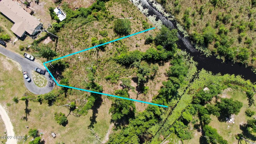 Three quarters of an acre, wooded, waterfront property in Leisure Lakes right off of 2301. Property is zoned for residential home or manufactured. The property's water access leads out to Deer Point Lake. The location is just minutes away from grocery stores and restaurants, while tucked back in a very quiet neighborhood. Owner financing is available with $8,500.00 down. Two other properties are available in the same area. 10403 Miller Circle and 00 2301.