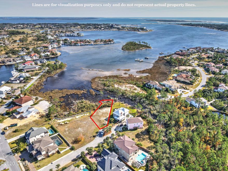 Waterfront homesite in Bay Point! Build your dream home and enjoy gorgeous views of the lagoon! Bay Point is a gated community with a wonderful lifestyle and amenities such as golf, tennis, restaurants and more! Take advantage of the Sheraton Bay Point Spa and resort amenities right next door in walking distance.  Enjoy biking, walking, running, and golf carting with friends and families around the neighborhood.  This lot is cleared and ready for you.  Call today!