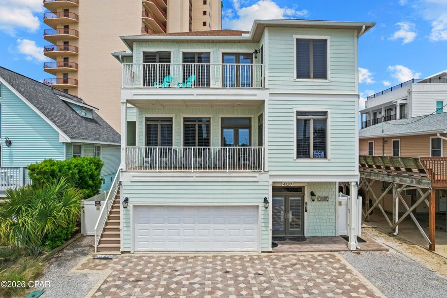 EXCEPTIONAL VALUE ALERT - PRICE IMPROVEMENT OF $150,000! Repriced for immediate sale, this elegant Mediterranean-style beach home presents an outstanding opportunity on the Emerald Coast. Located just 75 feet from the sugar white sand with Gulf views from multiple balconies, this spacious 3-story property is being offered FULLY FURNISHED and TURNKEY with  $215,000 in 2025  rental income and future bookings transferable to the new owner.

Featuring 7 bedrooms, 4 full baths, and approximately 3,451 square feet, this thoughtfully designed home offers flexibility for personal use, large groups, or vacation rental investment potential. Interior features include soaring 10-foot ceilings, custom cabinetry, granite countertops, stainless steel appliances, commercial-grade tile flooring, and abundant natural light throughout.

Designed with functionality in mind, the property includes TWO full kitchens, TWO laundry areas, and a lockout configuration ideal for maximizing occupancy and rental versatility. Spacious indoor and outdoor living areas provide ample room for entertaining and relaxing after a day at the beach.
Outdoor highlights include a PRIVATE HEATED POOL, expansive balconies with Gulf views, covered patio spaces, and ample parking with a 2-car garage plus 5 additional driveway parking spaces. Low annual HOA dues add to the appeal of this exceptional coastal property.

Whether you're searching for a primary residence, second home, or income-producing beach investment, this turnkey property offers space, location, and exceptional value in the heart of Panama City Beach.