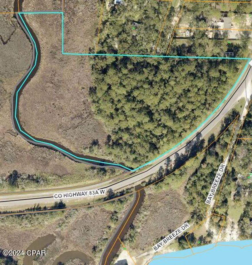 Nestled amidst the tranquil beauty of Freeport, Florida, this expansive 6.07-acre +/- property situated on Bear Creek offers an idyllic setting for your dream home with stunning views of Choctawhatchee Bay. Just off County Road 83A, the property provides a serene escape from the hustle and bustle, yet remains conveniently close to local amenities and the breathtaking beaches of the Emerald Coast.

Imagine building your custom home on this lush, green canvas. Enjoy the privacy and tranquility of your own personal sanctuary, while still being within easy reach of shopping, dining, and recreational activities. The property's accessibility and availability of nearby utilities make development a breeze.
This property offers the perfect blend of rural charm and modern convenience. Don't miss your chance to own a piece of Freeport's thriving community. 

This parcel is a portion of Parcel #32-1S-19-23000-002-0010, and is located across County Hwy 83A E.