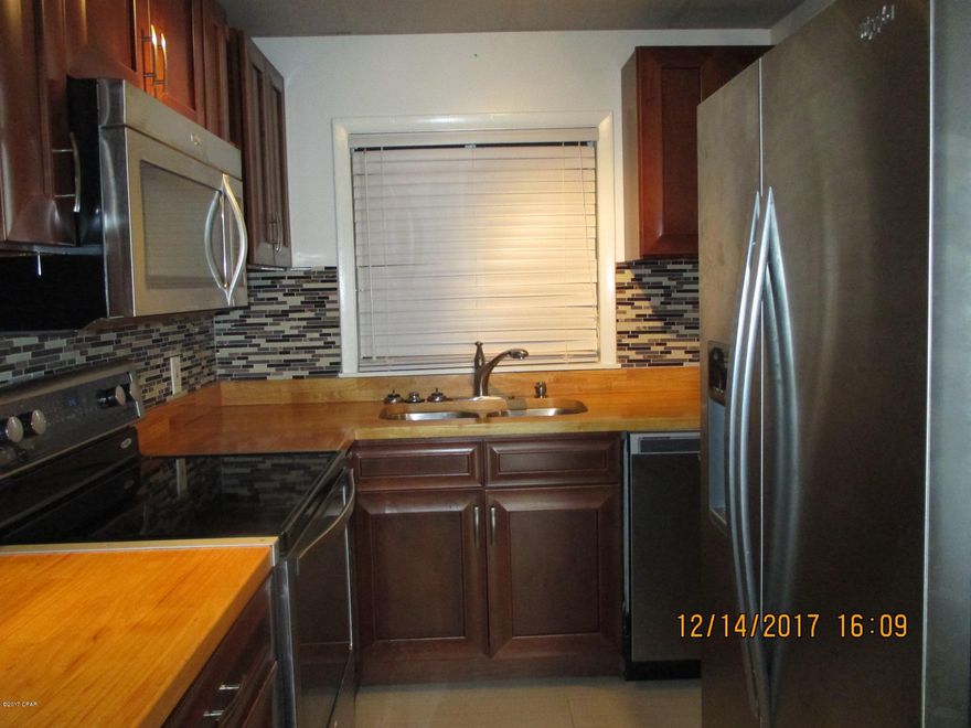 Completely remodeled 2 bedroom/2 bathroom condo close to all three courthouses and Sacred Heart Bay Medical with bayside pool, beach and sunset dock. New stainless appliances, new butcher block counter tops, new cabinets, and totally new glass shower bathrooms with new water heater. All new tile on walls and floors. This is not your ordinary rental/remodel, it was remodeled to be owner/occupied level. Washer/dryer hookup located inside unit. On ground floor of Allen Avenue building with designated parking for the unit and bay breezes at front and back. Large master bedroom with adjoining, private, spa style bathroom with walk in shower. Second generous bedroom immediately next to second hallway bathroom with totally new fixtures in each. Brand new upscale modern light fixtures and ceiling fans throughout. Enjoy the private pool, white sandy beach and long beautiful dock for relaxing bay breeze sunsets or fishing on St. Andrews Bay. All watercraft welcomed on limited bases. Many residents of this complex have kayaks, canoes and sailboats. WATER/SEWER/GARBAGE; PEST CONTROL, BASIC CABLE ARE ALL......... INCLUDED. You pay rent and power; all the above is on us. DO THE MATH Small pets welcome at additional fee. The BEST "BANG FOR BUCK"RESIDENTIAL DEAL AVAILABLE Totally remodeled, ultra modern all new everything! Small quiet complex in oldest and most exclusive neighborhood in town, featuring private pool, private beach, and private dock. Off street, assigned parking. Pets welcomed. Nearly constant bay breezes. The list goes on! Nearly impossible to find this entire group of preferred features in one package!