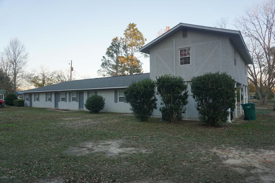 'CURRENTLY UNDER CONTRACT, SELLER ACCEPTING BACKUP OFFERS  Income producing investment property located in downtown Graceville, FL home of the Baptist College of Florida. This multi-family building consists of five units. Four of those units are two bedroom one bathroom, and the fifth one is two bedroom one and a half bathroom. All electrical has been redone, a new roof was installed 2 years ago, there are ceramic tile flooring throughout each unit and all have been recently updated. The parcel being sold has enough space for future growth and other adjacent properties are available to purchase from this same owner.