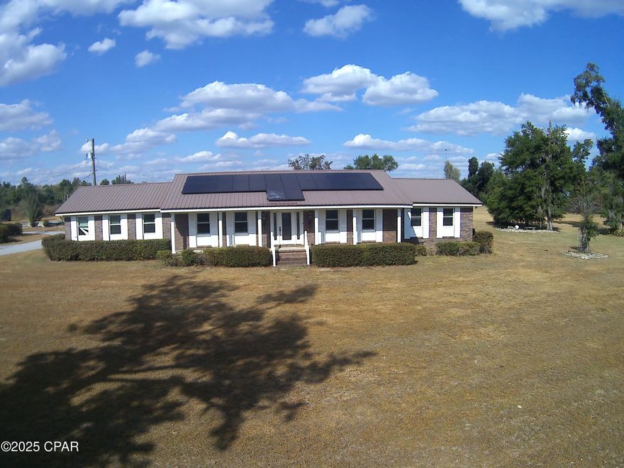 Brick home offering generous living space and a flexible floor plan. This three bedroom, two bath residence features a fenced in-ground pool for summer fun, an updated master bathroom with a  tile shower, and a versatile extra room that can serve as an office, nursery, or additional bedroom. Enjoy two very large living areas perfect for entertaining and daily family life, plus a huge kitchen with abundant cabinets and a spacious island for meal prep and gatherings. A two-car garage provides ample storage, making this a truly spacious home ready for comfortable, flexible living. 2.16 acres to be surveyed out of parent parcel. All measurements to be verified by buyer.