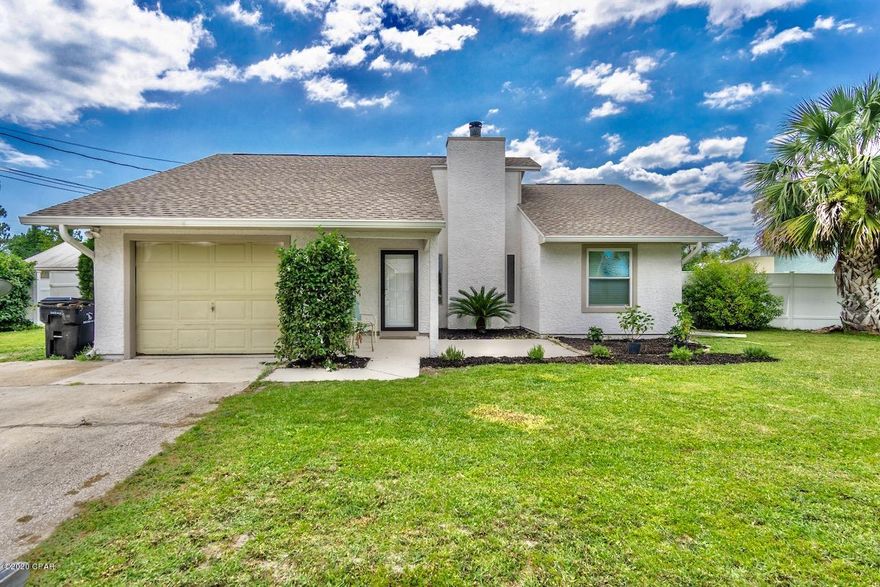 Enjoy all Panama City beach has to offer in this stunning 3 bedroom, 2 bathroom home.  This private community is conveniently located close to shopping, dining, Pier Park, the white sandy beaches and some of the best schools in Bay County. With over 1,500 sq.ft of generous living space you'll enjoy the perfect setting for relaxing or entertaining. The moment you pull in you will notice the attention to detail from the newly painted exterior to the freshly landscaped yard. Other highlights include a vinyl privacy fence, new roof, new paint in the exterior, new porcelain tile throughout the entire home, canned lighting added to the great room and master bedroom, a heated and cooled Florida room that has recently had new windows installed, New AC and the water heater was installed in the last 2 years. The great room with raised ceilings and an elegant touch of shiplap around the wood burning fireplace will have you feeling larger than life!

The sleek and stylish eat-in kitchen features new upgraded stainless steel appliances,  granite countertops, tiled backsplash and a large pantry. Fall in love with the spacious master bedroom and a very large walk in closet. The master bathroom has a tiled shower/tub. The additional bedrooms located on the other side of the home all have large closet space and plenty of space for sleep or study providing comfortable space for family and guests. The additional bathroom also has been updated with a tiled shower and floor. Keeping convenience in mind, the laundry room flows into the garage. 

Entertain in your privacy fenced yard, Perfect for gatherings and cook outs with family and friends. This home is a must see. For more information about the home or for a private showing call today!
