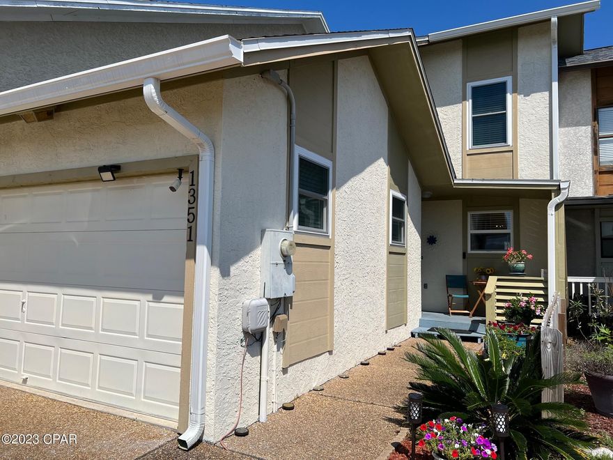 'CURRENTLY UNDER CONTRACT, SELLER WILL CONSIDER BACKUP OFFERS'  Come see all the improvements in this beautiful canal front 3 bedroom, 2.5 bath townhouse. No worries about moisture in this townhouse. The new sub floor, insulation of crawl space, jacks where needed and beautiful LVP flooring was just completed throughout the first floor. Oh, and the first floor was just painted too. Add in a newer roof, water heater, AC, and appliances and you have a worry free purchase. Want to bring a boat, ok!, There is a dock with electrical service and this deep water canal leads out to Goose Bayou, through St. Andrews Bay to the Gulf.  Don't have a boat, ok! Just sit and enjoy the water views from the dock, deck or the upstairs balcony. Like hot tubs, ok! The electric is installed for that as well as the platform below the deck to support it. Go buy one. Want some shade, ok! Roll out the awning at just the right time to shade the deck. Finishing off the first floor is a half bath and laundry room. The garage is an oversized single car garage with a pull down access to the attic. The upstairs has new carpet in 2 bedrooms, LVP in the primary bedroom, and all new windows. The brand new  patio door in the primary bedroom leads to the breezy balcony for hot summer nights or early summer mornings. You should live here. shade, ok! Roll out the awning at just the right time to shade the deck. Finishing off the first floor is a half bath and laundry room. The garage is an oversized single car garage with a pull down access to the attic. The upstairs has new carpet in 2 bedrooms, LVP in the primary bedroom, and all new windows. The brand new  patio door in the primary bedroom leads to the breezy balcony for hot summer nights or early summer mornings. You should live here.