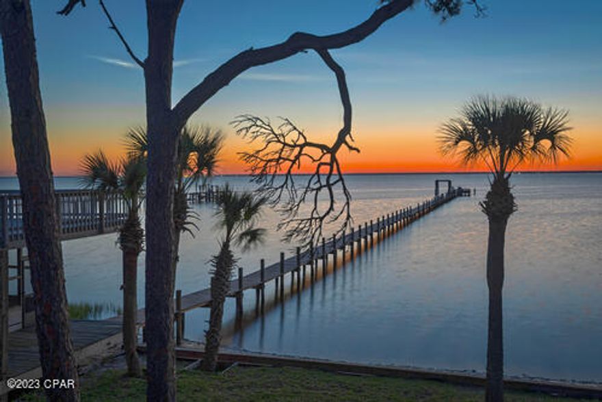 Spectacular Legacy Florida Home located on 5 acres with 252 Bayfront feet on coveted Cape San Blas. Offerings like this rarely come to the market as they present an opportunity to purchase a legacy homestead and/or develop the parcel into a multi-family development. This home is one-in-a-million, a rare gem, and has served as a place of refuge and family fun for vacationers nationwide. The current owner self-manages this beautiful property. This home has custom hardwood floors, custom cabinetry, and wooden decks surrounding the property with a pool and 500-foot dock.
Oak floors and ceilings abound, giving his home a historic Florida cottage feel with consistent wood accents. Many describe it as "Old Florida".  The house matches the setting immaculately. 
The porches on this home overlook the Bay of Cape San Blas, and even the two master bedrooms have private porches.
An elevator is positioned at the bottom level of the home, giving easy access to the main living area.
The living room is massive, and the kitchen opens into the living space with an informal dining area perfect for family entertainment.
Prepare to be amazed when you tour this expansive 5-acre property.
A 5-acre legacy parcel, unfortunately, never (if ever) comes to market, so please be sure to schedule your tour today.
