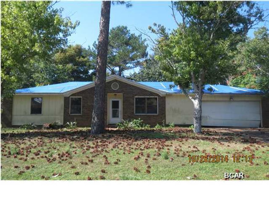 LOADS OF POSSIBILITIES WITH THIS FOUR-BEDROOM, THREE-BATH HOME IN DESIRABLE VENETIAN VILLA NEIGHBORHOOD. This home has an open floor plan with a spacious living room with a fireplace that is open to the kitchen. There are three bedrooms and two full baths off the living area, and a separate bedroom and full bath behind the large laundry. Outside is a large screened porch and a yard building in the backyard. Home being sold in its AS IS condition.