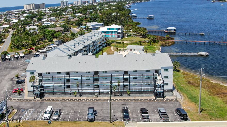 'CURRENTLY UNDER CONTRACT, SELLER ACCEPTING BACKUP OFFERS' Recently Remodeled Lagoon front 2nd floor 1 bedroom 1 bath condo. Treasure Cove sits on the south side of Grand Lagoon. The living room looks over the pool area with a lagoon view. The kitchen has stainless steel appliances with new cabinets and granite countertop. The bedroom is spacious with plenty of closet space.